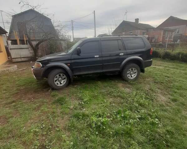 Чорний Міцубісі Паджеро Спорт, об'ємом двигуна 3 л та пробігом 230 тис. км за 8000 $, фото 1 на Automoto.ua
