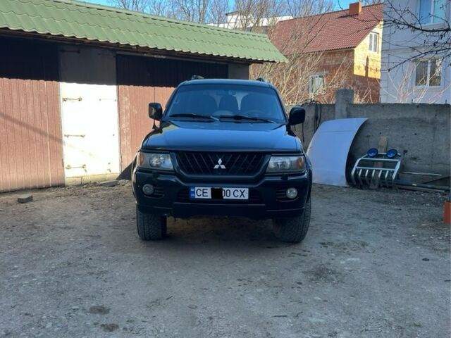 Чорний Міцубісі Паджеро Спорт, об'ємом двигуна 3 л та пробігом 313 тис. км за 6900 $, фото 1 на Automoto.ua
