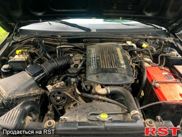 Чорний Міцубісі Паджеро Спорт, об'ємом двигуна 3 л та пробігом 383 тис. км за 7000 $, фото 9 на Automoto.ua