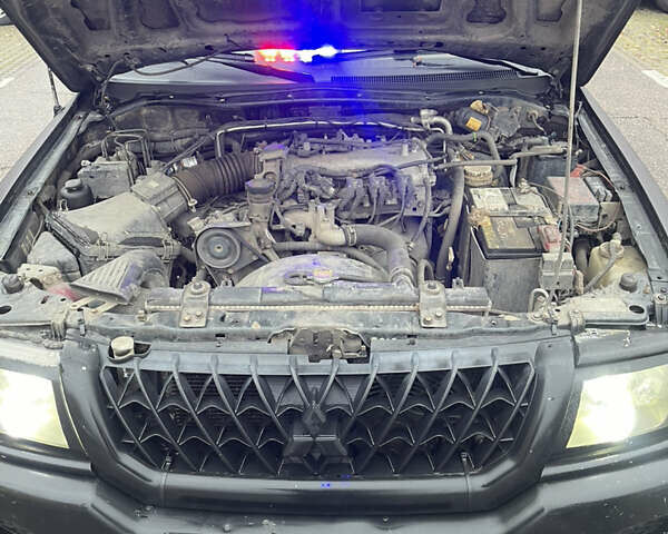 Черный Мицубиси Паджеро Спорт, объемом двигателя 3 л и пробегом 300 тыс. км за 5300 $, фото 19 на Automoto.ua