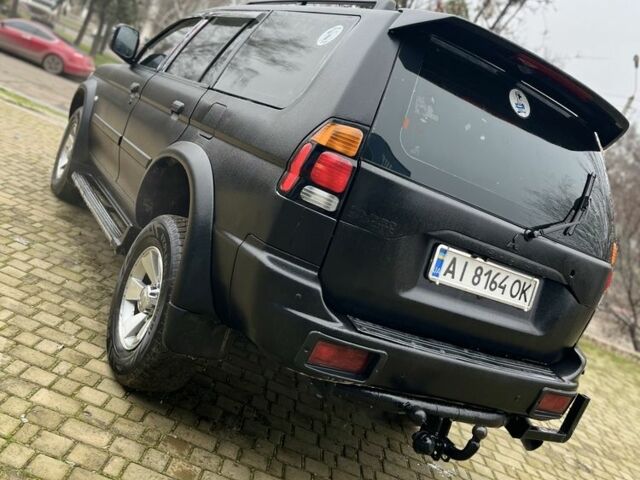 Чорний Міцубісі Паджеро Спорт, об'ємом двигуна 3 л та пробігом 200 тис. км за 5500 $, фото 3 на Automoto.ua