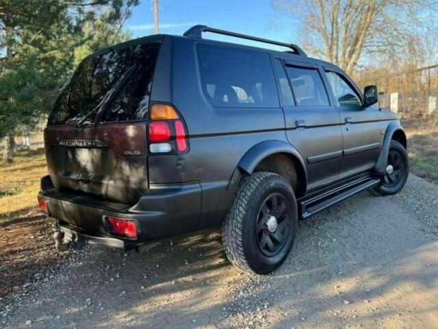 Черный Мицубиси Паджеро Спорт, объемом двигателя 2.5 л и пробегом 239 тыс. км за 2950 $, фото 4 на Automoto.ua