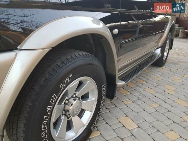 Черный Мицубиси Паджеро Спорт, объемом двигателя 3 л и пробегом 176 тыс. км за 8950 $, фото 4 на Automoto.ua