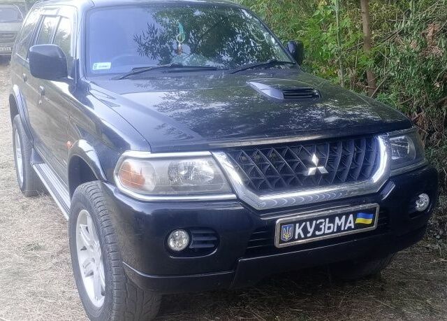 Чорний Міцубісі Паджеро Спорт, об'ємом двигуна 2.5 л та пробігом 300 тис. км за 6500 $, фото 3 на Automoto.ua