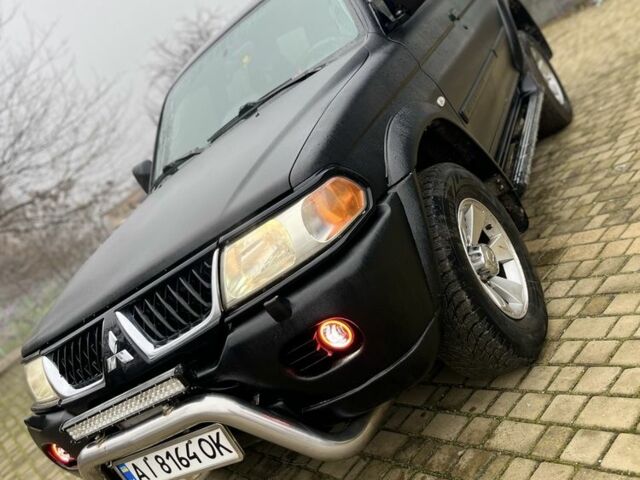 Чорний Міцубісі Паджеро Спорт, об'ємом двигуна 3 л та пробігом 200 тис. км за 5500 $, фото 1 на Automoto.ua