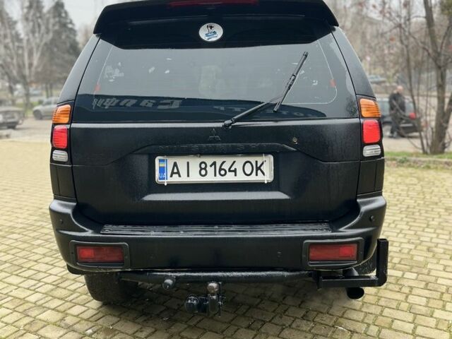 Чорний Міцубісі Паджеро Спорт, об'ємом двигуна 3 л та пробігом 200 тис. км за 5500 $, фото 4 на Automoto.ua