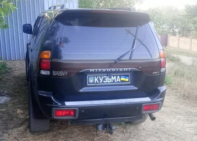 Чорний Міцубісі Паджеро Спорт, об'ємом двигуна 2.5 л та пробігом 300 тис. км за 6500 $, фото 4 на Automoto.ua