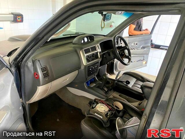 Черный Мицубиси Паджеро Спорт, объемом двигателя 3 л и пробегом 100 тыс. км за 4500 $, фото 2 на Automoto.ua