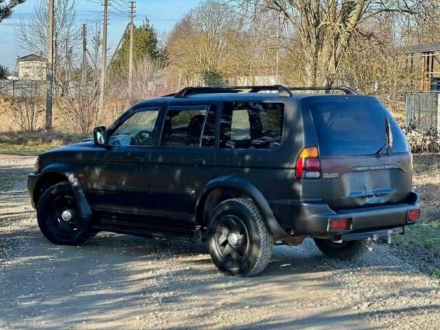 Черный Мицубиси Паджеро Спорт, объемом двигателя 2.5 л и пробегом 239 тыс. км за 2950 $, фото 5 на Automoto.ua