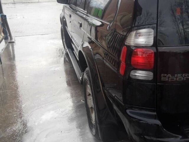 Чорний Міцубісі Паджеро Спорт, об'ємом двигуна 2.5 л та пробігом 209 тис. км за 8300 $, фото 2 на Automoto.ua