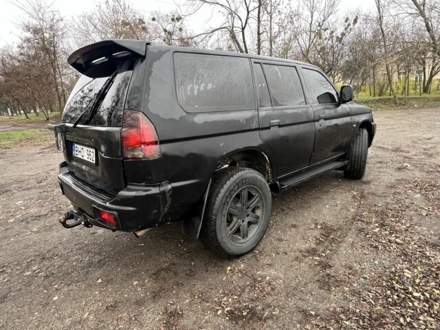 Чорний Міцубісі Паджеро Спорт, об'ємом двигуна 2.5 л та пробігом 402 тис. км за 4200 $, фото 3 на Automoto.ua