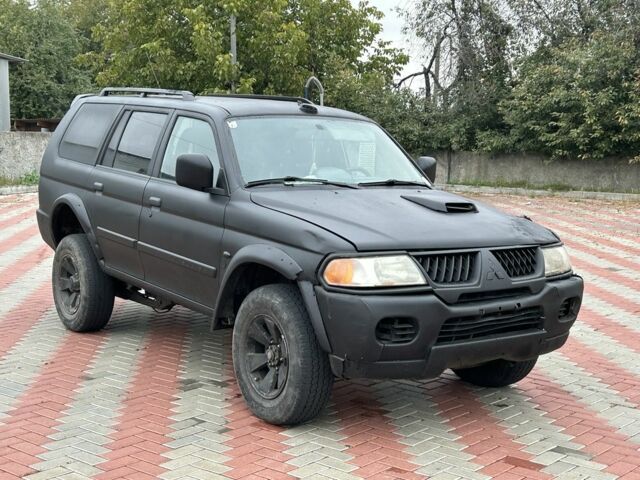 Чорний Міцубісі Паджеро Спорт, об'ємом двигуна 2.5 л та пробігом 220 тис. км за 2750 $, фото 6 на Automoto.ua