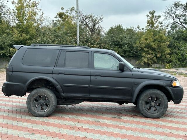 Чорний Міцубісі Паджеро Спорт, об'ємом двигуна 2.5 л та пробігом 220 тис. км за 2750 $, фото 5 на Automoto.ua