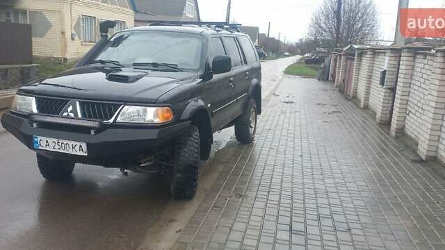 Черный Мицубиси Паджеро Спорт, объемом двигателя 2.5 л и пробегом 220 тыс. км за 10200 $, фото 1 на Automoto.ua