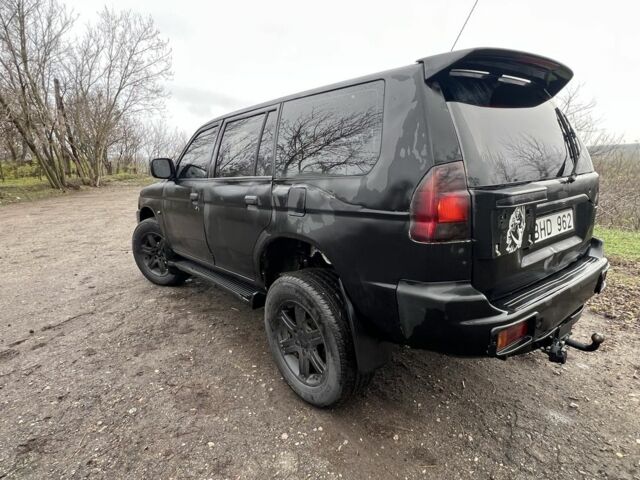 Чорний Міцубісі Паджеро Спорт, об'ємом двигуна 2.5 л та пробігом 402 тис. км за 4200 $, фото 4 на Automoto.ua