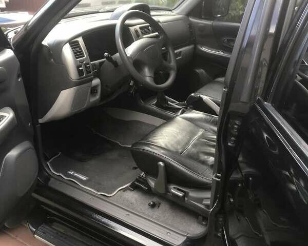 Черный Мицубиси Паджеро Спорт, объемом двигателя 2.5 л и пробегом 220 тыс. км за 10200 $, фото 5 на Automoto.ua