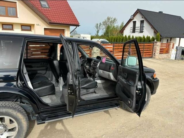 Чорний Міцубісі Паджеро Спорт, об'ємом двигуна 2.5 л та пробігом 308 тис. км за 4800 $, фото 10 на Automoto.ua