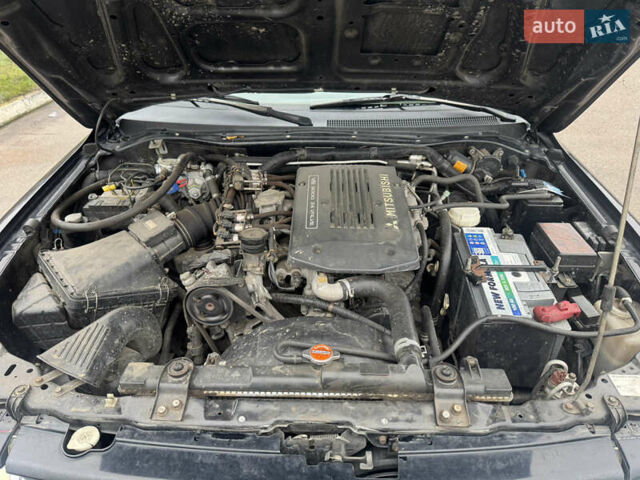 Черный Мицубиси Паджеро Спорт, объемом двигателя 3 л и пробегом 240 тыс. км за 8500 $, фото 13 на Automoto.ua