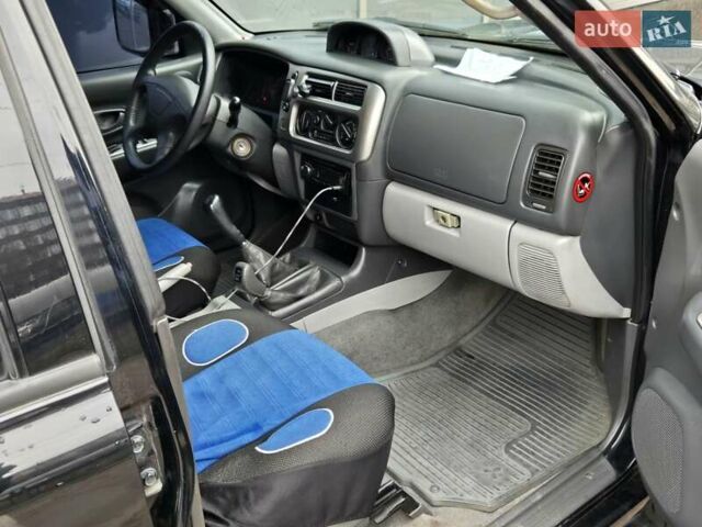 Чорний Міцубісі Паджеро Спорт, об'ємом двигуна 2.5 л та пробігом 345 тис. км за 9900 $, фото 9 на Automoto.ua