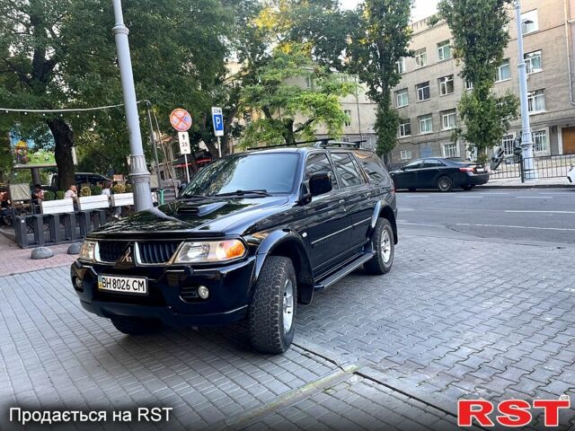 Чорний Міцубісі Паджеро Спорт, об'ємом двигуна 2.5 л та пробігом 165 тис. км за 14000 $, фото 2 на Automoto.ua