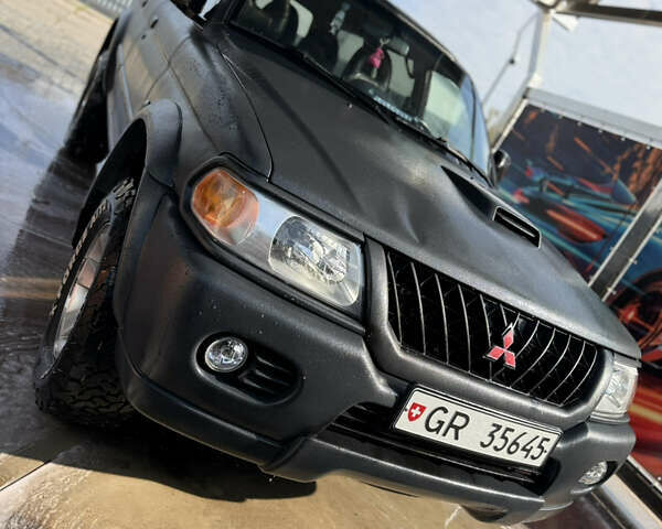 Чорний Міцубісі Паджеро Спорт, об'ємом двигуна 2.5 л та пробігом 330 тис. км за 7000 $, фото 4 на Automoto.ua