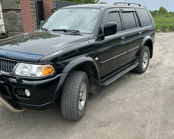 Черный Мицубиси Паджеро Спорт, объемом двигателя 3 л и пробегом 220 тыс. км за 8200 $, фото 2 на Automoto.ua