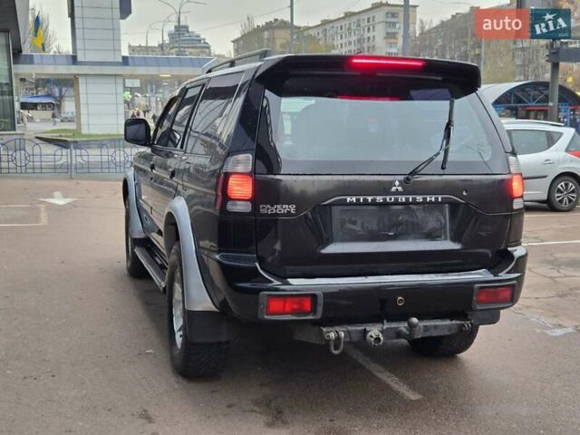 Чорний Міцубісі Паджеро Спорт, об'ємом двигуна 2.5 л та пробігом 345 тис. км за 9900 $, фото 3 на Automoto.ua