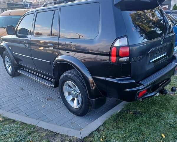 Чорний Міцубісі Паджеро Спорт, об'ємом двигуна 3.01 л та пробігом 310 тис. км за 8300 $, фото 6 на Automoto.ua