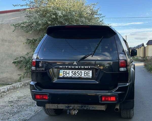 Чорний Міцубісі Паджеро Спорт, об'ємом двигуна 2.5 л та пробігом 101 тис. км за 13700 $, фото 1 на Automoto.ua
