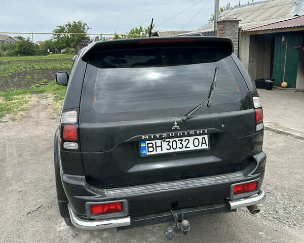 Черный Мицубиси Паджеро Спорт, объемом двигателя 3 л и пробегом 220 тыс. км за 8200 $, фото 3 на Automoto.ua