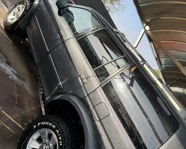 Чорний Міцубісі Паджеро Спорт, об'ємом двигуна 2.5 л та пробігом 330 тис. км за 7000 $, фото 1 на Automoto.ua