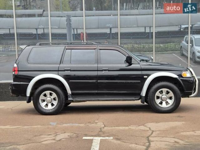 Чорний Міцубісі Паджеро Спорт, об'ємом двигуна 2.5 л та пробігом 345 тис. км за 9900 $, фото 6 на Automoto.ua