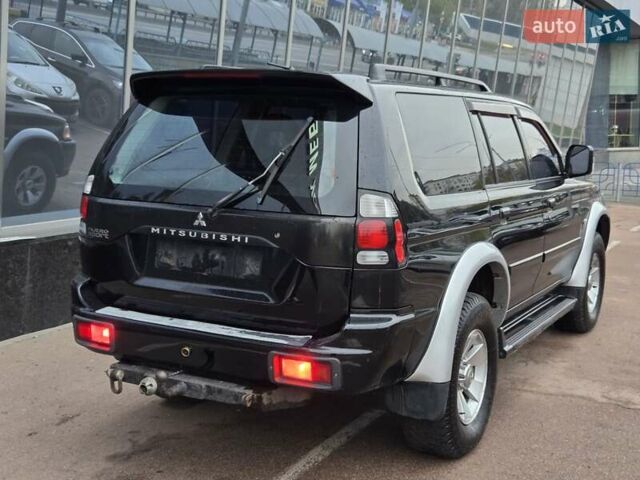 Чорний Міцубісі Паджеро Спорт, об'ємом двигуна 2.5 л та пробігом 345 тис. км за 9900 $, фото 5 на Automoto.ua