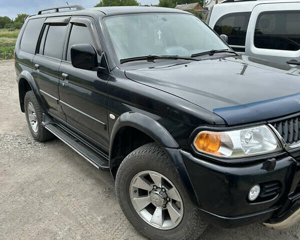 Черный Мицубиси Паджеро Спорт, объемом двигателя 3 л и пробегом 220 тыс. км за 8200 $, фото 1 на Automoto.ua