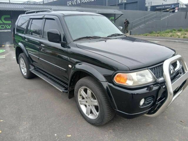 Чорний Міцубісі Паджеро Спорт, об'ємом двигуна 3 л та пробігом 200 тис. км за 8300 $, фото 1 на Automoto.ua