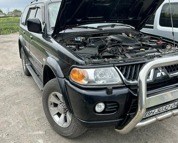 Черный Мицубиси Паджеро Спорт, объемом двигателя 3 л и пробегом 220 тыс. км за 8200 $, фото 4 на Automoto.ua