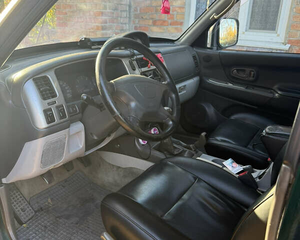 Чорний Міцубісі Паджеро Спорт, об'ємом двигуна 2.5 л та пробігом 330 тис. км за 7000 $, фото 5 на Automoto.ua