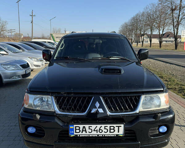 Черный Мицубиси Паджеро Спорт, объемом двигателя 2.48 л и пробегом 163 тыс. км за 10500 $, фото 1 на Automoto.ua