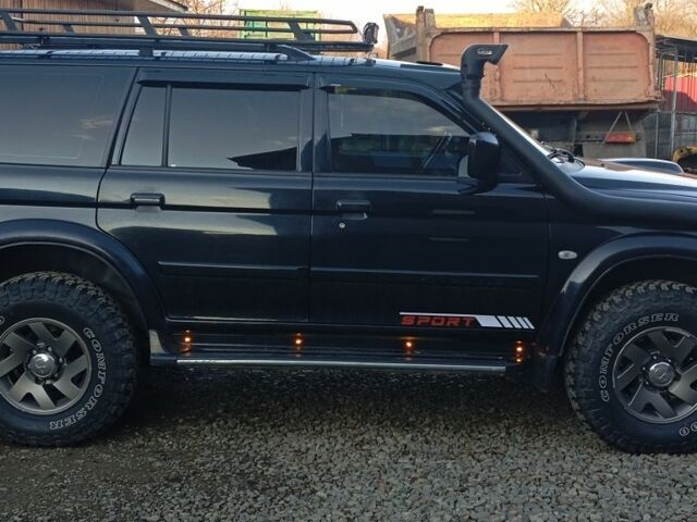 Чорний Міцубісі Паджеро Спорт, об'ємом двигуна 2.5 л та пробігом 279 тис. км за 13000 $, фото 2 на Automoto.ua