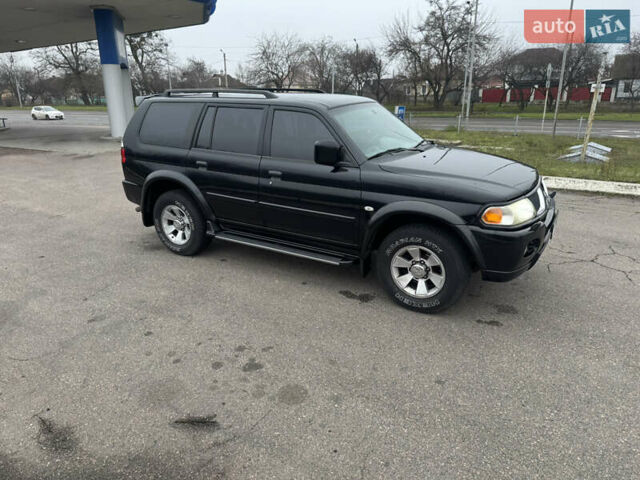 Черный Мицубиси Паджеро Спорт, объемом двигателя 3 л и пробегом 240 тыс. км за 8500 $, фото 2 на Automoto.ua