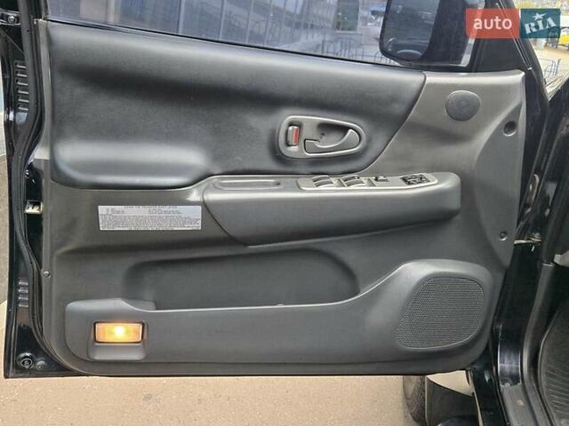 Чорний Міцубісі Паджеро Спорт, об'ємом двигуна 2.5 л та пробігом 345 тис. км за 9900 $, фото 13 на Automoto.ua