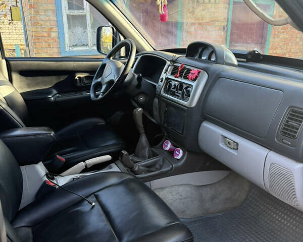 Чорний Міцубісі Паджеро Спорт, об'ємом двигуна 2.5 л та пробігом 330 тис. км за 7000 $, фото 6 на Automoto.ua