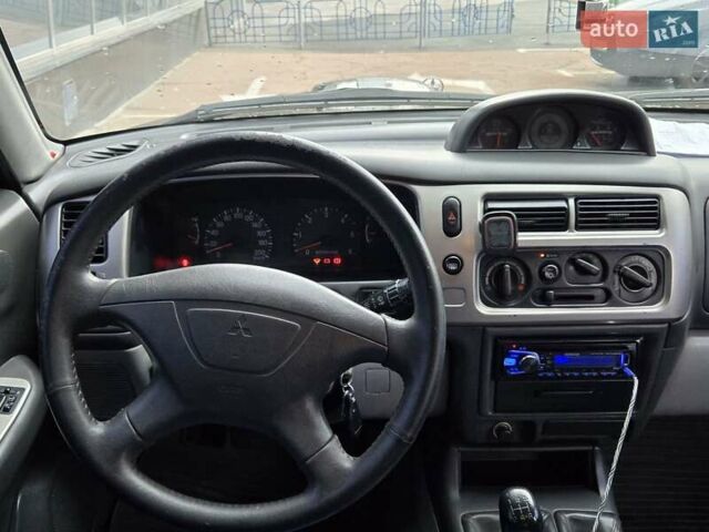 Чорний Міцубісі Паджеро Спорт, об'ємом двигуна 2.5 л та пробігом 345 тис. км за 9900 $, фото 18 на Automoto.ua