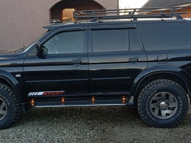 Чорний Міцубісі Паджеро Спорт, об'ємом двигуна 2.5 л та пробігом 279 тис. км за 13000 $, фото 1 на Automoto.ua