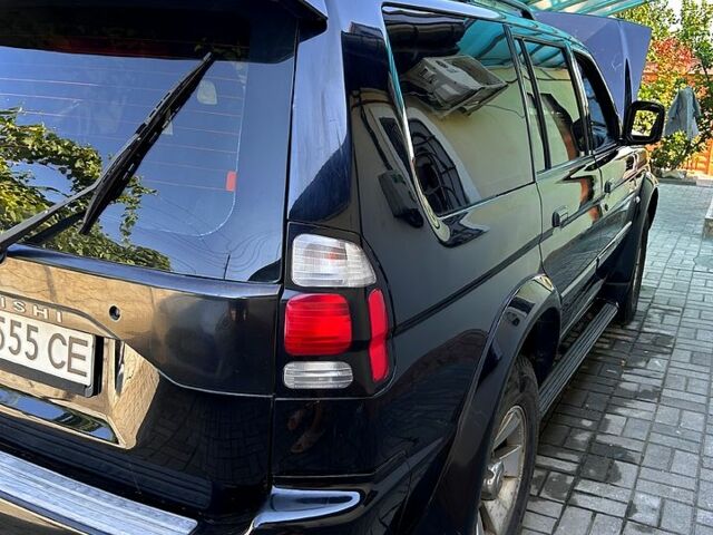 Черный Мицубиси Паджеро Спорт, объемом двигателя 3 л и пробегом 208 тыс. км за 8700 $, фото 3 на Automoto.ua