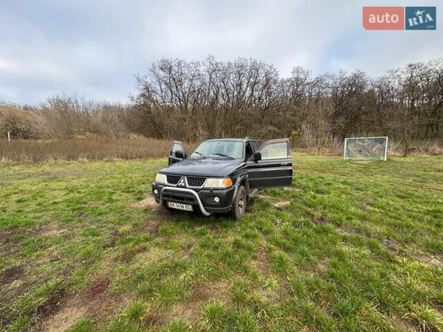 Черный Мицубиси Паджеро Спорт, объемом двигателя 3 л и пробегом 180 тыс. км за 8600 $, фото 1 на Automoto.ua