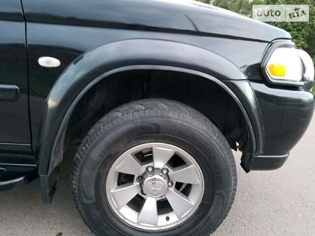 Черный Мицубиси Паджеро Спорт, объемом двигателя 2.5 л и пробегом 264 тыс. км за 11200 $, фото 8 на Automoto.ua