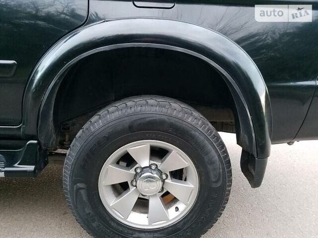 Черный Мицубиси Паджеро Спорт, объемом двигателя 2.5 л и пробегом 264 тыс. км за 11200 $, фото 6 на Automoto.ua