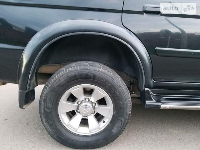 Черный Мицубиси Паджеро Спорт, объемом двигателя 2.5 л и пробегом 264 тыс. км за 11200 $, фото 7 на Automoto.ua