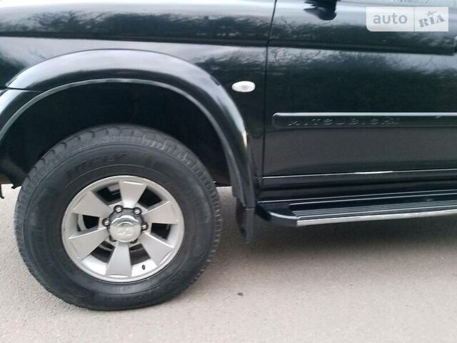 Черный Мицубиси Паджеро Спорт, объемом двигателя 2.5 л и пробегом 264 тыс. км за 11200 $, фото 5 на Automoto.ua